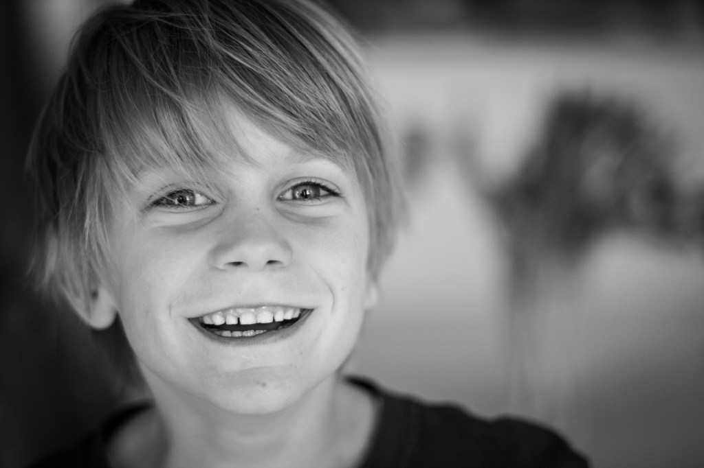 It's getting harder and harder to get the kids to sit for even 10 seconds for a photo...and even harder to get a shot where it doesn't look like they're posing. So I will treasure this photo for a long time as it truly captures Josh at his best.  