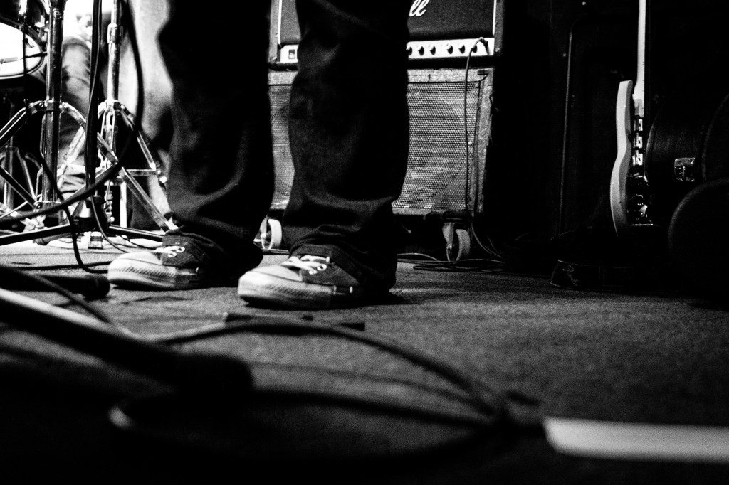 On the night our choir (The Septemberists) were performing, I figured this was an excellent opportunity to get some experience shooting photos of bands on stage. I set myself the challenge of shooting everything manually (exposure, f-stop etc). It was a complete disaster...so out of desperation I took a shot of some worn out sneakers, on sticky carpet and with an amp in the background. It said pretty much everything I wanted to say about rock n roll 